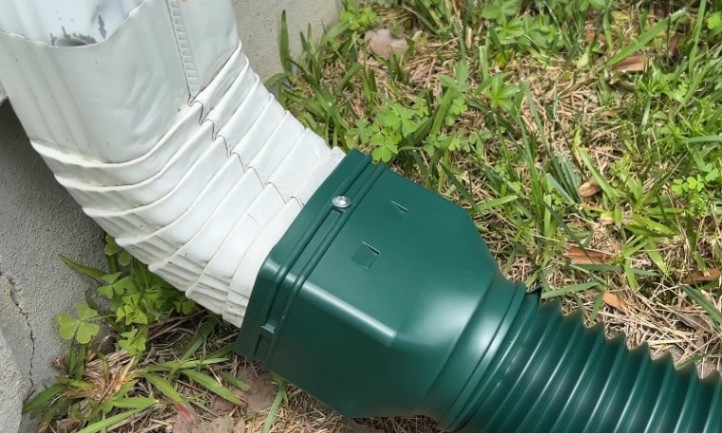 A green and white pipe with a white cover